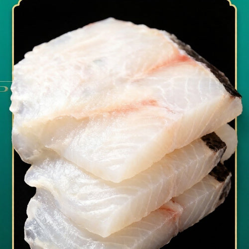 Stack of raw white fish slices showing a clean grain